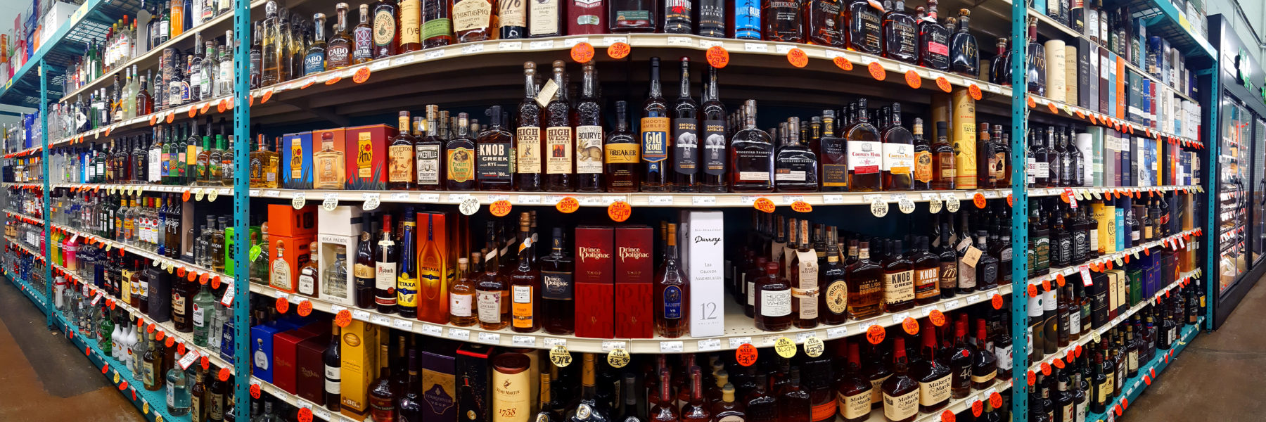 alcohol retail shelf massive bottles price tax